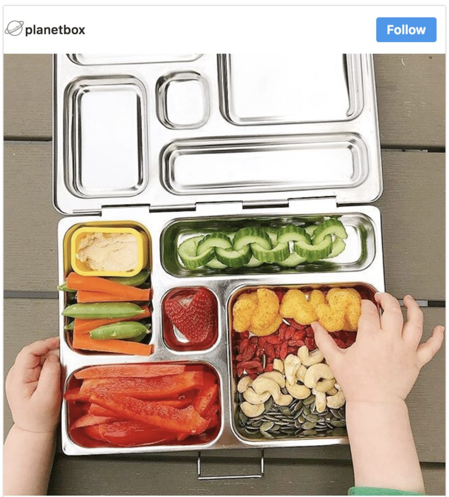 Kids healthy lunchbox with vegetables fruits and nuts