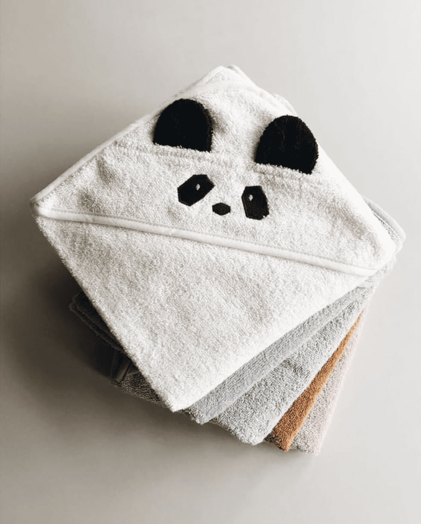 Stack of hooded baby towels by Liewood