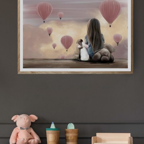 nursery wall art of girl sitting with rabbits watching pink hot air balloons at sunset