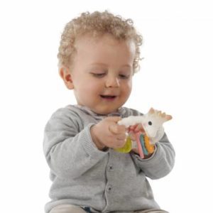 Baby playing with Sophie the Giraffe Colo'rings teether
